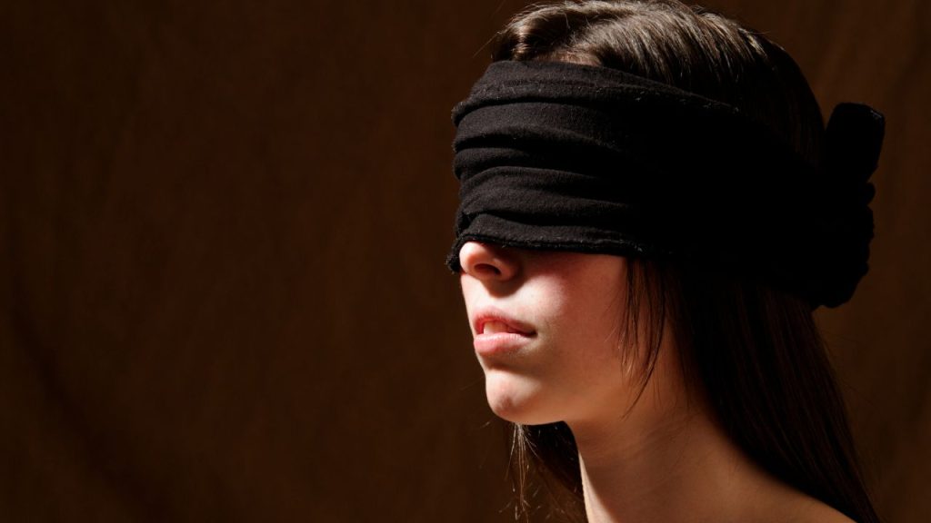 A blindfolded woman